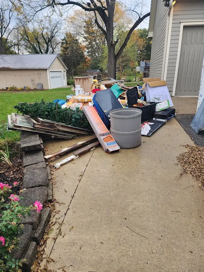 Dumpster being loaded with debris for 3 Yard Dumpster Rental in South Sarasota